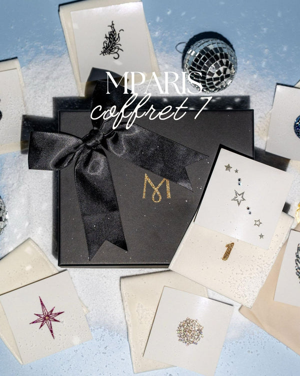 Coffret 7 jours avant Noël M Paris : écrin noir, ruban satin et 7 pochons numérotés